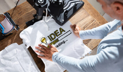 stock-photo-man-printing-image-on-t-shirt-in-workshop-1475631437 copy